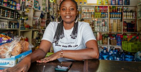 Small business owner standing inside her shop
