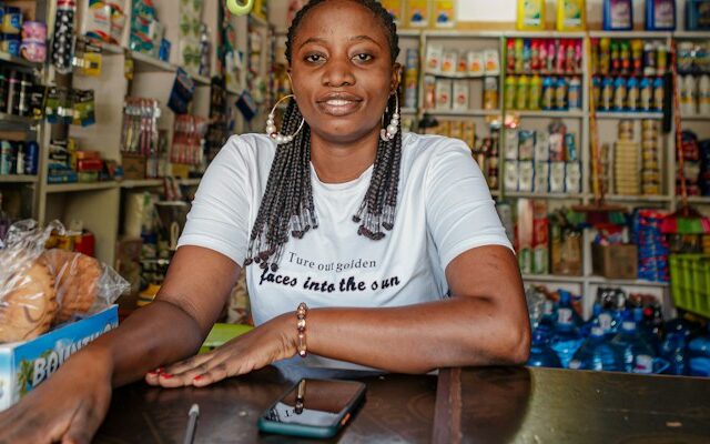 Small business owner standing inside her shop