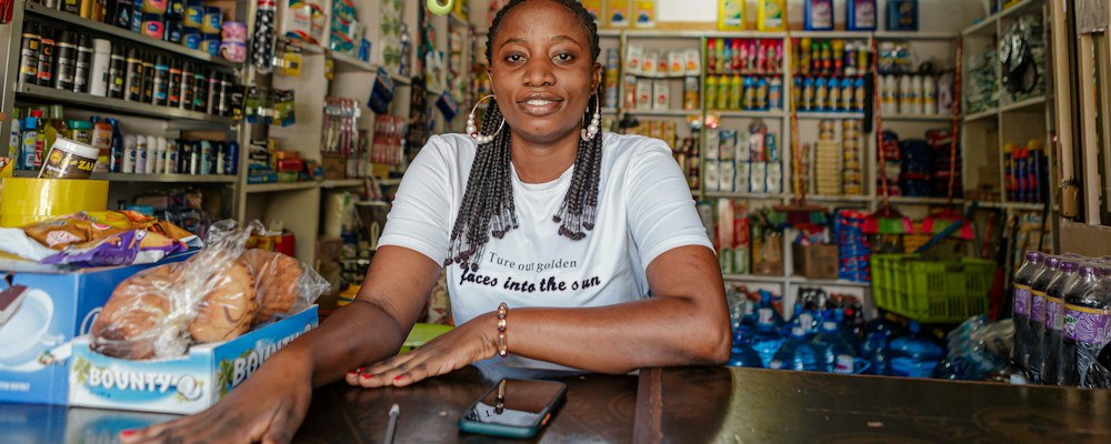 Small business owner standing inside her shop